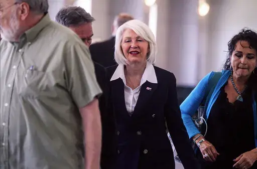 Former Mesa County, Colo., county clerk Tina Peters, center, arrives at the Mesa County Justice Center for her trial Monday, Aug. 12, 2024, in Grand Junction, Colo. (Larry Robinson/Grand Junction Sentinel via AP)