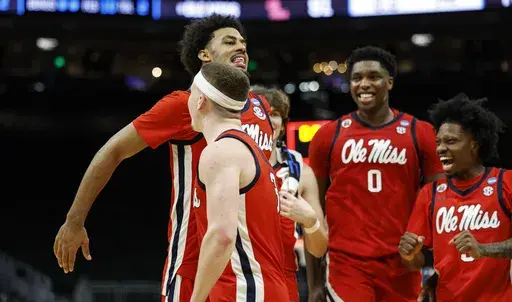 Mississippi forward Jaemyn Brakefield (4) reacts with guard Sean Pedulla (3) against Iowa State during the second half in the second round of the NCAA college basketball tournament Sunday, March 23, 2025, in Milwaukee. (AP Photo/Jeffrey Phelps)