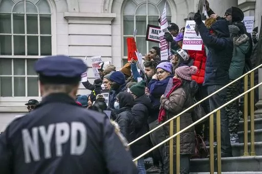 A coalition of community groups and advocates for the How Many Stops Act coalition hold a rally at City Hall, Tuesday, Jan. 30, 2024, in New York, to urge the City Council to override Mayor Adams veto of the act, requiring police officers to document basic information whenever they question someone. (AP Photo/Bebeto Matthews)
