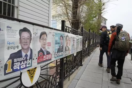 People pass by posters of candidates running for the upcoming parliamentary election in Seoul, South Korea, Wednesday, April 3, 2024. As South Koreans prepare to vote for a new 300-member parliament next week, many are choosing their livelihoods and other domestic topics as their most important election issues. This represents a stark contrast from past elections, which were overshadowed by security and foreign policy issues like North Korean nuclear threats and the U.S. security commitment.(AP 
