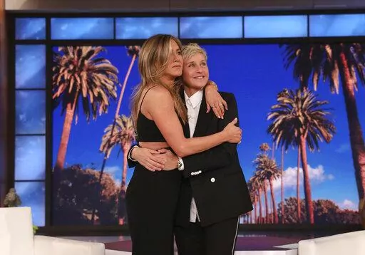 In this photo released by Warner Bros., talk show host Ellen DeGeneres, right, is embraced by Jennifer Aniston during the final taping of "The Ellen DeGeneres Show" at the Warner Bros. lot in Burbank, Calif. (Michael Rozman/Warner Bros. via AP)