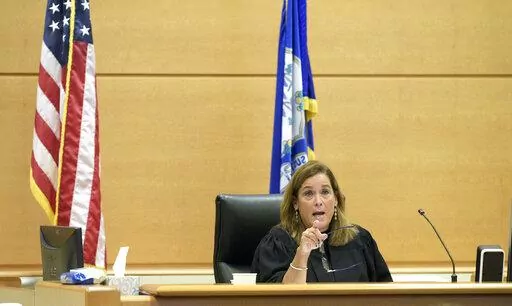 Superior Court Judge Barbara Bellis speaks with the attorneys during the Alex Jones Sandy Hook defamation damages trial in Superior Court in Waterbury, Conn., on Thursday, Oct. 2022. (H John Voorhees III/Hearst Connecticut Media via AP, Pool)