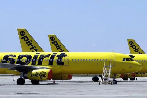 FLE - A line of Spirit Airlines jets sit on the tarmac at the Orlando International Airport on May 20, 2020, in Orlando, Fla. JetBlue is buying Spirit Airlines, Thursday, July 28, 2022, in a $3.8 billion deal, a day after Spirit and Frontier Airlines agreed to abandon their merger proposal.  (AP Photo/Chris O'Meara, File)