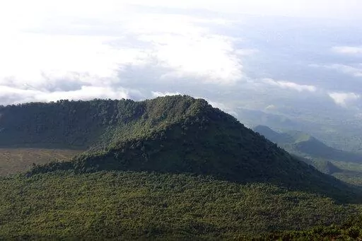 This Dec. 11, 2016, photo shows the Virunga National Park, taken from the rim of the crater of the Nyiragongo volcano and looking over the crater of another, extinct volcano, in North Kivu Province, Democratic Republic of the Congo. Several oil and gas fields in the DRC, including some in the park, are being put up for auction starting Thursday, July 28, 2022, prompting outrage from environmental groups. (Juergen Baetz/dpa via AP, File)