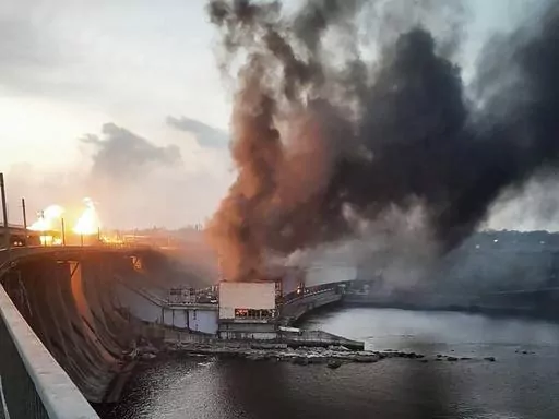 In this photo provided by Telegram Channel of Ukraine's Prime Minister Denys Shmyhal, smoke and fire rise over the Dnipro hydroelectric power plant after Russian attacks in Dnipro, Ukraine, Friday, March 22, 2024. (Telegram Channel of Ukraine's Prime Minister Denys Shmyhal via AP)