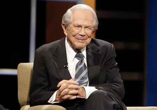 Rev. Pat Robertson poses a question to a Republican presidential candidate during a forum at Regent University in Virginia Beach, Va., Oct. 23, 2015. Robertson, a religious broadcaster who turned a tiny Virginia station into the global Christian Broadcasting Network, tried a run for president and helped make religion central to Republican Party politics in America through his Christian Coalition, has died. He was 93. Robertson's death Thursday, June 8, 2023 was announced by his broadcasting netw