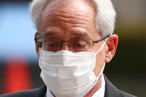 Greg Kelly, former executive of Japanese automaker Nissan, walks in to the Tokyo District Court in Tokyo Thursday, March 3, 2022. (Zhang Xiaoyu/Pool Photo via AP)