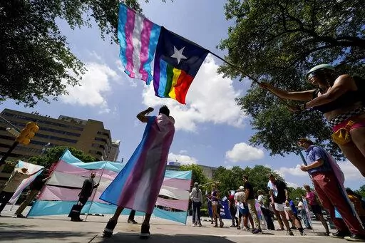 Demonstrators gather on the steps to the State Capitol to speak against transgender-related legislation bills being considered in the Texas Senate and Texas House, May 20, 2021 in Austin, Texas. The Texas Supreme Court is allowing the state to investigate parents of transgender youth for child abuse. But in a mixed ruling Friday, May 13, 2022, the court also handed a victory to one family that was among the first contacted by child welfare officials following an order by Republican Gov. Greg Abb