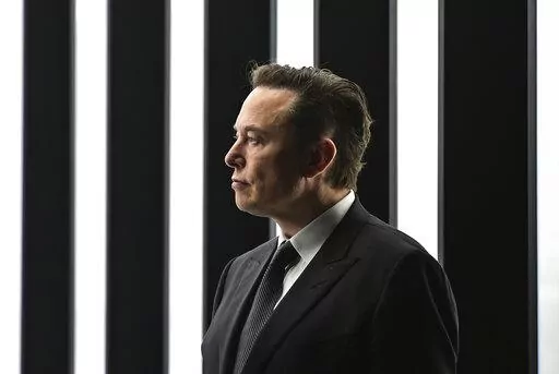 Elon Musk, Tesla CEO, attends the opening of the Tesla factory Berlin Brandenburg in Gruenheide, Germany, March 22, 2022. The intrigue surrounding Musk's Twitter investment took a new twist Tuesday, April 12, 2022, with the filing of a lawsuit alleging the colorful billionaire illegally delayed disclosing his big stake in the social media company so he could buy more shares at lower prices. (Patrick Pleul/Pool Photo via AP, File)