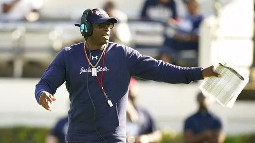 Jackson State football coach Deion Sanders calls out a play in the first half of Jackson State's Blue and White Spring NCAA college football game April 24, 2022, in Jackson, Miss. Last season, Sanders' second as Jackson State head coach, the Tigers went 11-2 and won the Southwestern Athletic Conference. Then Sanders signed two Power Five-level recruits to the HBCU, an unprecedented recruiting feat. (AP Photo/Rogelio V. Solis, File)