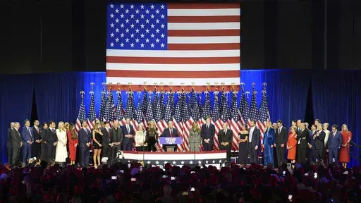 Donald Trump speaks at an election night watch party, joined by a crew of longtime friends, aides and new allies. (AP Photo/Lynne Sladky)