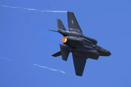 U.S. Air Force fighter aircraft F-35 performs aerobatic maneuvers on the second day of the Aero India 2023 at Yelahanka air base in Bengaluru, India, Tuesday, Feb. 14, 2023. An independent Sweden-based watchdog says the world military spending has grown for the eighth consecutive year in 2022 to an all-time high of $2240 billion leading to a sharp rise of 13% taking place in Europe, chiefly due to Russian and Ukrainian expenditure. (AP Photo/Aijaz Rahi, File)