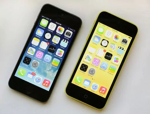 The iPhone 5S, left, and iPhone 5c are displayed, Sept. 17, 2013, in New York. As telecom companies rev up the newest generation of mobile service, called 5G, they’re shutting down old networks — a costly, years-in-the-works process that’s now prompting calls for a delay because a lot of products out there still rely on the old standard, 3G. AT&T in mid-February is the first to shut down the 3G network, which first launched in the U.S. just after the turn of the millennium. AT&T says a del