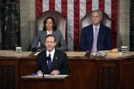 Israeli President Isaac Herzog speaks to a joint session of Congress, Wednesday, July 19, 2023, at the Capitol in Washington, as Vice President Kamala Harris and House Speaker Kevin McCarthy of Calif., look on. (AP Photo/Jacquelyn Martin)
