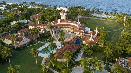 This is an aerial view of President Donald Trump's Mar-a-Lago estate, Aug. 10, 2022, in Palm Beach, Fla. The National Archives and Records Administration recovered 100 documents bearing classified markings, totaling more than 700 pages, from a initial batch of 15 boxes retrieved from Mar-a-Lago earlier this year. That's according to newly public correspondence with the Trump legal team. (AP Photo/Steve Helber, File)