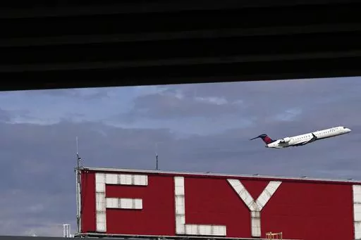 A Delta airplane takes off from Hartsfield-Jackson Atlanta International Airport in Atlanta, Tuesday, Nov. 22, 2022. Sticking with one airline, hotel or car rental brand and avoiding others is the basic premise of brand loyalty. The benefits are clear: more points toward future award travel and elite status benefits. Yet, brand loyalty means eschewing other options, which could cost less or be more convenient. (AP Photo/Brynn Anderson, File)