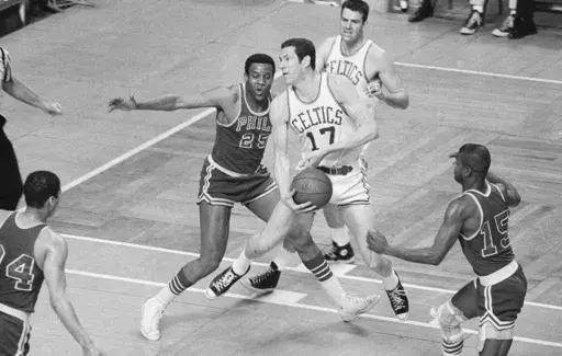 Boston Celtics' John Havlicek (17) is defended by Philadelphia 76ers' Chet Walker (25) during the first half of an NBA basketball playoff game April 14, 1968, in Boston. Walker, a seven-time All-Star forward who helped Wilt Chamberlain and the 76ers win the 1967 NBA title, has died. He was 84. The National Basketball Players Association confirmed Walker's death, according to NBA.com. The 76ers, Chicago Bulls and National Basketball Retired Players Association also extended their condolences on s