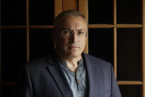 Russian opposition figure Mikhail Khodorkovsky, the former owner of the Yukos Oil Co., poses for a photo after being interviewed by The Associated Press in London, Tuesday, July 24, 2018. After President Vladimir Putin came to power in 2000, he was reported to have told about two dozen of the men regarded as Russia's top oligarchs that if they stayed out of politics, their wealth wouldn't be touched. Khodorkovsky, regarded as Russia's richest man at the time, established the Open Society reformi