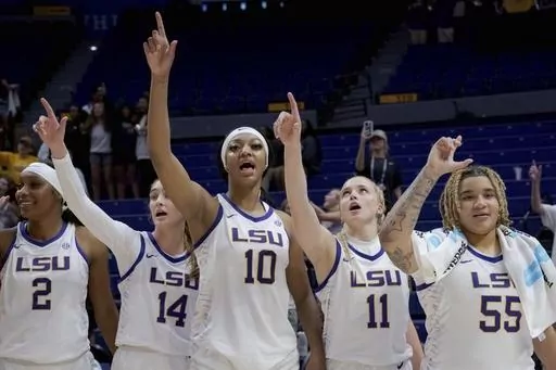 LSU forward Amani Bartlett (2), guard Mikaylah Williams (12), forward Angel Reese (10), guard Hailey Van Lith (11), and guard Kateri Poole (55) sing the school alma mater after an NCAA college basketball exhibition game against East Texas Baptist, Thursday, Oct. 26, 2023, in Baton Rouge, La. (AP Photo/Matthew Hinton)