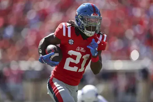 Mississippi running back Henry Parrish Jr. (21) runs the ball during the first half of an NCAA college football game against Middle Tennessee, Saturday, Sept. 7, 2024, in Oxford, Miss. (AP Photo/Randy J. Williams)