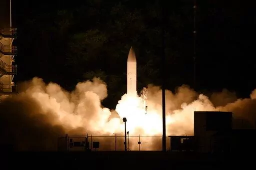 This handout photo provided by the U.S. Navy shows a common hypersonic glide body (C-HGB) launching from the Pacific Missile Range Facility, in Kauai, Hawaii, March 19, 2020, during a Department of Defense flight experiment. The department is working in collaboration with industry and academia to field hypersonic war-fighting capabilities. (Luke Lamborn/U.S. Navy via AP)