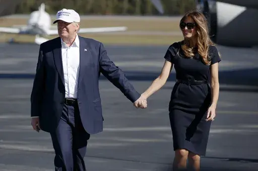 Republican presidential candidate Donald Trump, left, and his wife Melania arrive to a campaign rally, Nov. 5, 2016, in Wilmington, N.C. (AP Photo/ Evan Vucci, File)