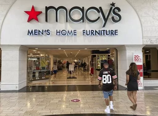 Shoppers walk into a Macy's department store Monday, Feb. 22, 2021, at Miami International Mall in Doral, Fla. Macy's reports earnings on Thursday, Nov. 16, 2023. (AP Photo/Wilfredo Lee, File)