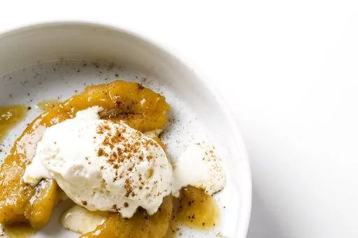 This image released by Milk Street shows a recipe for miso-spiced rum bananas foster. (Milk Street via AP)