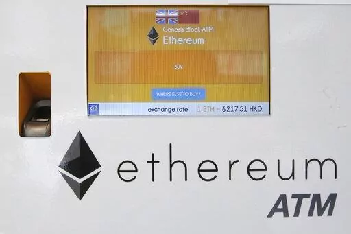 An ethereum ATM is seen in Hong Kong, Friday, May 11, 2018. A complex software change enacted Wednesday, Sept. 14, 2022, to the cryptocurrency ethereum holds the potential to dramatically reduce its energy consumption — and resulting climate-related pollution. But the transition known as "the merge" is not going to do the trick by itself. (AP Photo/Kin Cheung, File)