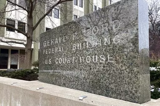 The exterior of the federal courthouse is shown March 9, 2022, in Grand Rapids, Mich. The trial of four men charged with planning to kidnap Michigan Gov. Gretchen Whitmer is taking place inside. (AP Photo/Mike Householder)