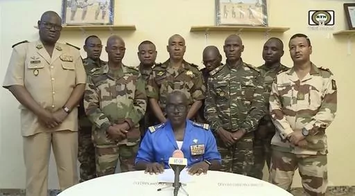 In this image taken from video provided by ORTN, Col. Maj. Amadou Abdramane, front center, makes a statement on July 26, 2023, in Niamey, Niger, as a delegation of military officers appeared on Niger State TV to read out a series of communiques announcing their coup d'etat. The U.S. is scrambling to assess the future of its counterterrorism operations in the Sahel region of Africa after the ruling junta in Niger announced it was ending military cooperation with Washington. (ORTN via AP, File)