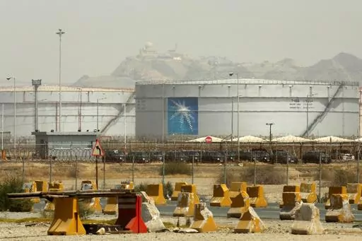 Storage tanks are seen at the North Jiddah bulk plant, an Aramco oil facility, in Jiddah, Saudi Arabia, on March 21, 2021. Saudi oil giant Aramco reported Sunday, March 10, 2024 a $121 billion profit last year, down from its 2022 record due to lower energy prices. (AP Photo/Amr Nabil, File)