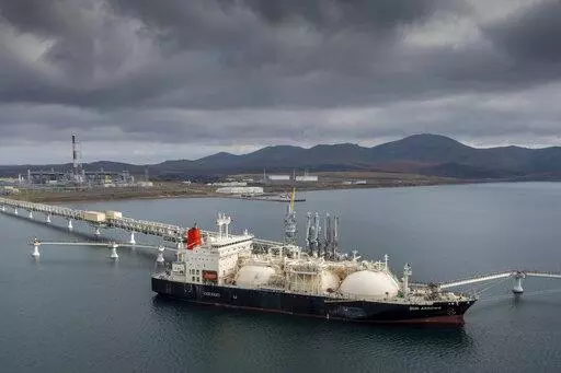 The tanker Sun Arrows loads its cargo of liquefied natural gas from the Sakhalin-2 project in the port of Prigorodnoye, Russia, on Oct. 29, 2021. The United States unleashed some of its toughest actions against Russian President Vladimir Putin right after he rolled his troops into Ukraine. Polls show people want the U.S. to do more. (AP Photo/File)
