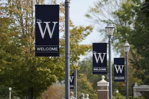 Mississippi University for Women banners decorate the campus in Columbus, Miss., Oct. 23, 2023. The university announced a proposal Tuesday, Feb. 13, 2024, to change its name to Wynbridge State University of Mississippi, with officials saying the new name is supposed to reflect the diversity of the public institution that has been enrolling men since 1982. (AP Photo/Rogelio V. Solis, File)