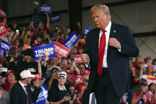 Republican presidential nominee former President Donald Trump dances at a campaign rally at Gastonia Municipal Airport, Saturday, Nov. 2, 2024, in Gastonia, N.C. (AP Photo/Evan Vucci)