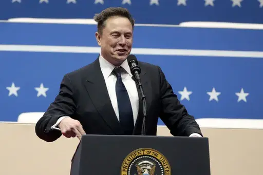 Elon Musk speaks at an indoor Presidential Inauguration parade event in Washington, Jan. 20, 2025. (AP Photo/Matt Rourke, File)