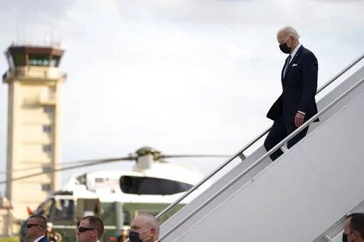 U.S. President Joe Biden, right, disembarks from Air Force One on his arrival at Yokota Air Base, Sunday, May 22, 2022, in Fussa, on the outskirt of Tokyo, Japan. (AP Photo/Evan Vucci)