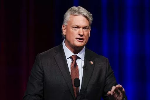Mike Collins participates in a Republican primary debate for Georgia's 10th Congressional District, June 6, 2022, in Atlanta. Collins, who won a U.S. House seat in 2022, issued a statement Monday, May 6, 2024, saying that he stands by his admiration of college students who push back against those protesting the Israel-Hamas war, but he backtracked somewhat on his earlier praise of a counter-protest at the University of Mississippi that included a man appearing to make monkey noises and gestures 