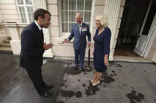 Britain's Prince Charles and Camilla, Duchess of Cornwall welcome French president Emmanuel Macron to Clarence House in London, Thursday June 18, 2020. Unrest in France is tarnishing the sheen of King Charles III’s first overseas trip as monarch. Striking workers have refused to provide red carpets and critics are calling for the British king's visit to be canceled altogether amid pension reform protests. (Jonathan Brady/Pool via AP, File)