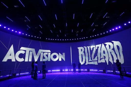The Activision Blizzard Booth is shown on June 13, 2013, during the Electronic Entertainment Expo in Los Angeles. Microsoft’s plan to buy video game giant Activision Blizzard for $68.7 billion could have major effects on the gaming industry, transforming the Xbox maker into something like a Netflix for video games by giving it control of many more popular titles. But to get to the next level, Microsoft must first survive a barrage of government inquiries from various countries. An upcoming dec