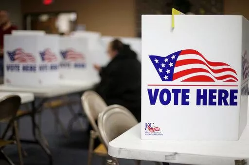 A woman votes in the presidential primary election at the the Summit View Church of the Nazarene in Kansas City, Mo., on March 10, 2020. Newspaper endorsements for candidates are fading away, a victim of both the news industry's troubles and the era's bitter politics. Earlier this month, newspapers controlled by hedge fund Alden Global Capital said they would no longer endorse candidates for president, governor and U.S. Senate. They include dozens of dailies like the Chicago Tribune, New York Da