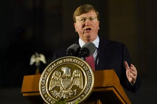 Republican Gov. Tate Reeves describes the state's economic progress during his State of the State address before a joint session of the Mississippi Legislature on the steps of the State Capitol in Jackson, Miss., on Jan. 30, 2023. Reeves did an abrupt about-face Sunday, Feb. 26, 2023, on an issue for which Democrats have been criticizing him this election year, saying for the first time that he wants the state to allow a full year of Medicaid coverage to women after they give birth. (AP Photo/Ro