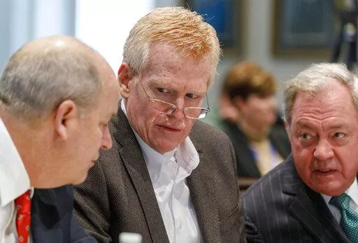Defendant Alex Murdaugh, seated between his two layers Jim Griffin and Dick Harpootlian, listens during his double murder trial at the Colleton County Courthouse in Walterboro, S.C., Friday, Jan. 27, 2023. (Grace Beahm Alford/The Post And Courier via AP, Pool)