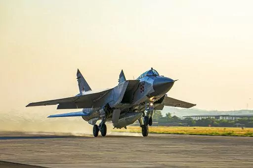 In this photo released by Russian Defense Ministry Press Service, a Russian MiG-31 fighter jet carrying a Kinzhal missile takes off from the Hemeimeem air base in Syria on June 25, 2021. The Russian military on Friday launched sweeping maneuvers in the Mediterranean Sea featuring warplanes capable of carrying hypersonic missiles, a show of force amid a surge in tensions following an incident with a British destroyer in the Black Sea. (Russian Defense Ministry Press Service via AP, File)