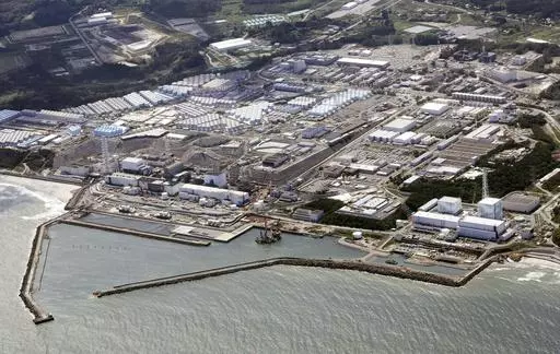 This aerial view shows the wrecked Fukushima Daiichi nuclear power plant in Okuma town, northeastern Japan, on Aug. 24, 2023. A drone small enough to fit in one's hand flew inside one of the damaged reactors at the wrecked nuclear power plant Wednesday, Feb. 28, 2024, in hopes it can examine some of the molten fuel debris in areas where earlier robots failed to reach. (Kyodo News via AP, File)