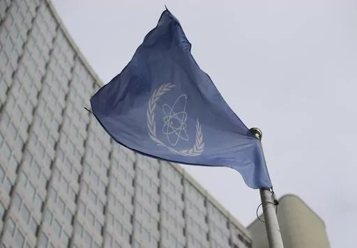The flag of the International Atomic Energy Agency flies in front of its headquarters during an IAEA Board of Governors meeting in Vienna, Austria, Monday, Feb. 6, 2023. Iran has slowed its enrichment of uranium at nearly weapons-grade levels, a report by the United Nations' nuclear watchdog seen by The Associated Press said Monday, Sept. 4, 2023. (AP Photo/Heinz-Peter Bader, File)