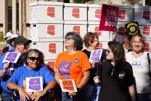 Arizona abortion-rights supporters gather for a news conference prior to delivering more than 800,000 petition signatures to the state Capitol to get abortion rights on the November general election ballot, July 3, 2024, in Phoenix. (AP Photo/Ross D. Franklin, File)