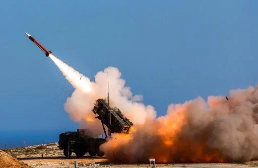 In this image released by the U.S. Department of Defense, German soldiers assigned to Surface Air and Missile Defense Wing 1, fire the Patriot weapons system at the NATO Missile Firing Installation, in Chania, Greece, on Nov. 8, 2017. Patriot missile systems have long been a hot ticket item for the U.S. and allies in contested areas of the world as a coveted shield against incoming missiles. In Europe, the Middle East and the Pacific, they guard against potential strikes from Iran, Somalia and N