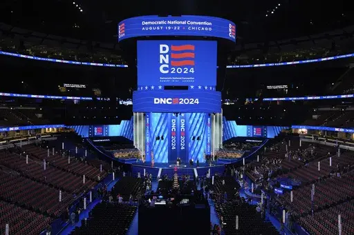 Workers prepare the convention floor at United Center before the Democratic National Convention Sunday, Aug. 18, 2024, in Chicago. (AP Photo/Paul Sancya)