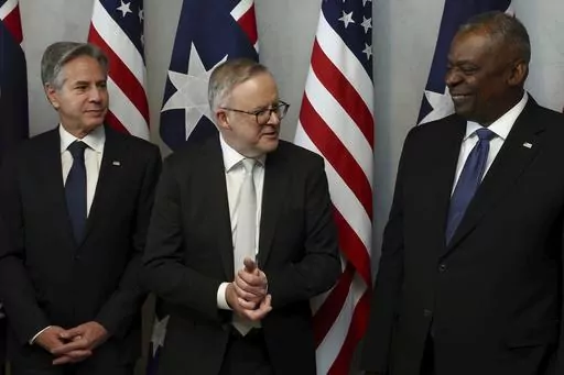 Australian Prime Minister Anthony Albanese, center, speaks with U.S. Secretary of State Antony Blinken, left, and U.S. Defense Secretary Lloyd Austin prior to a lunch in Brisbane, Australia Friday, July 28, 2023. (Pat Hoelscher/Pool Photo via AP)